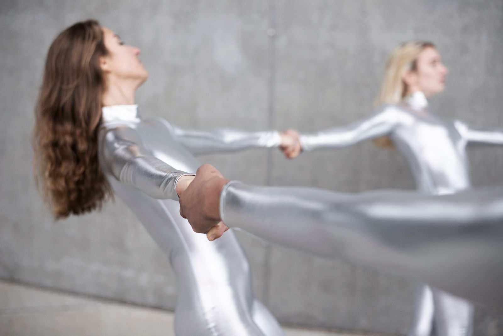 Dancers dressed in silver bodysuits perform Taneli Törmä's work ALIEN in outdoor public spaces